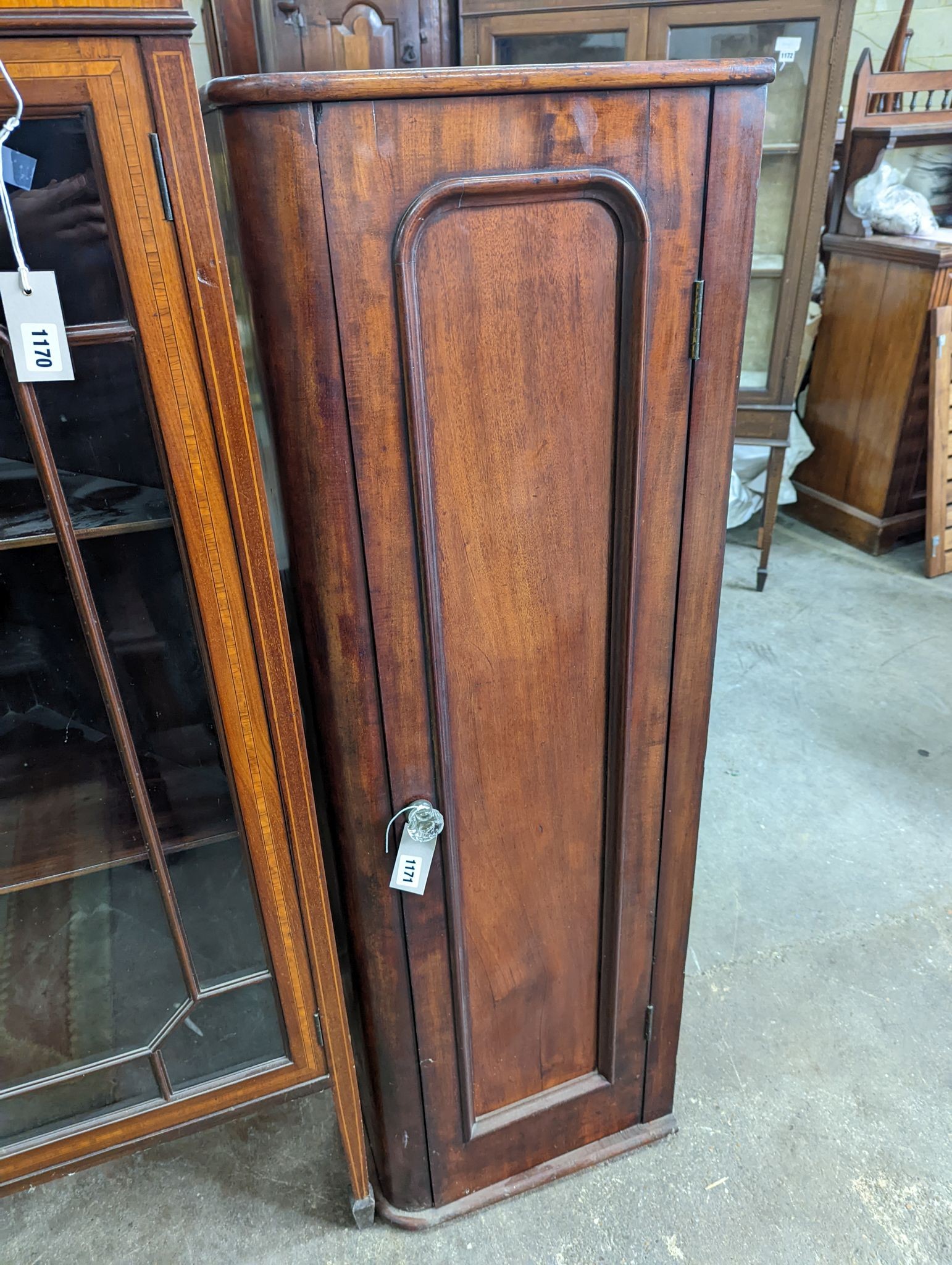 A Victorian mahogany narrow cabinet, (altered) width 43cm, depth 25cm, height 133cm